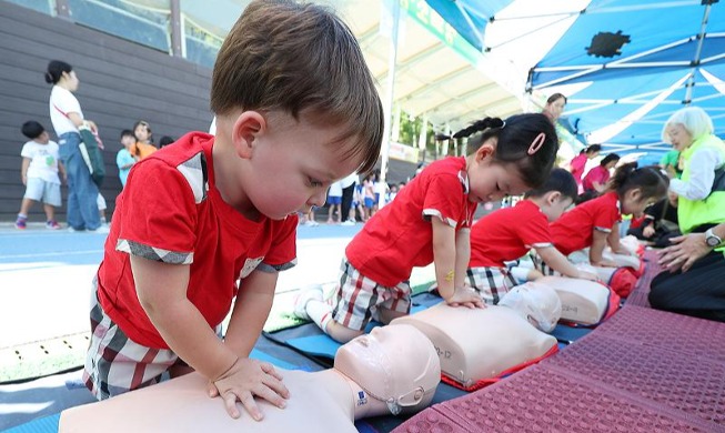 Cute little hands practicing CPR