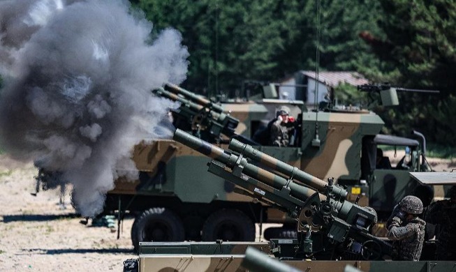 Military drill featuring wheeled self-propelled howitzer